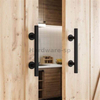 Rustic barn door with vintage iron handles in a farmhouse-style kitchen, showcasing natural wood grain
